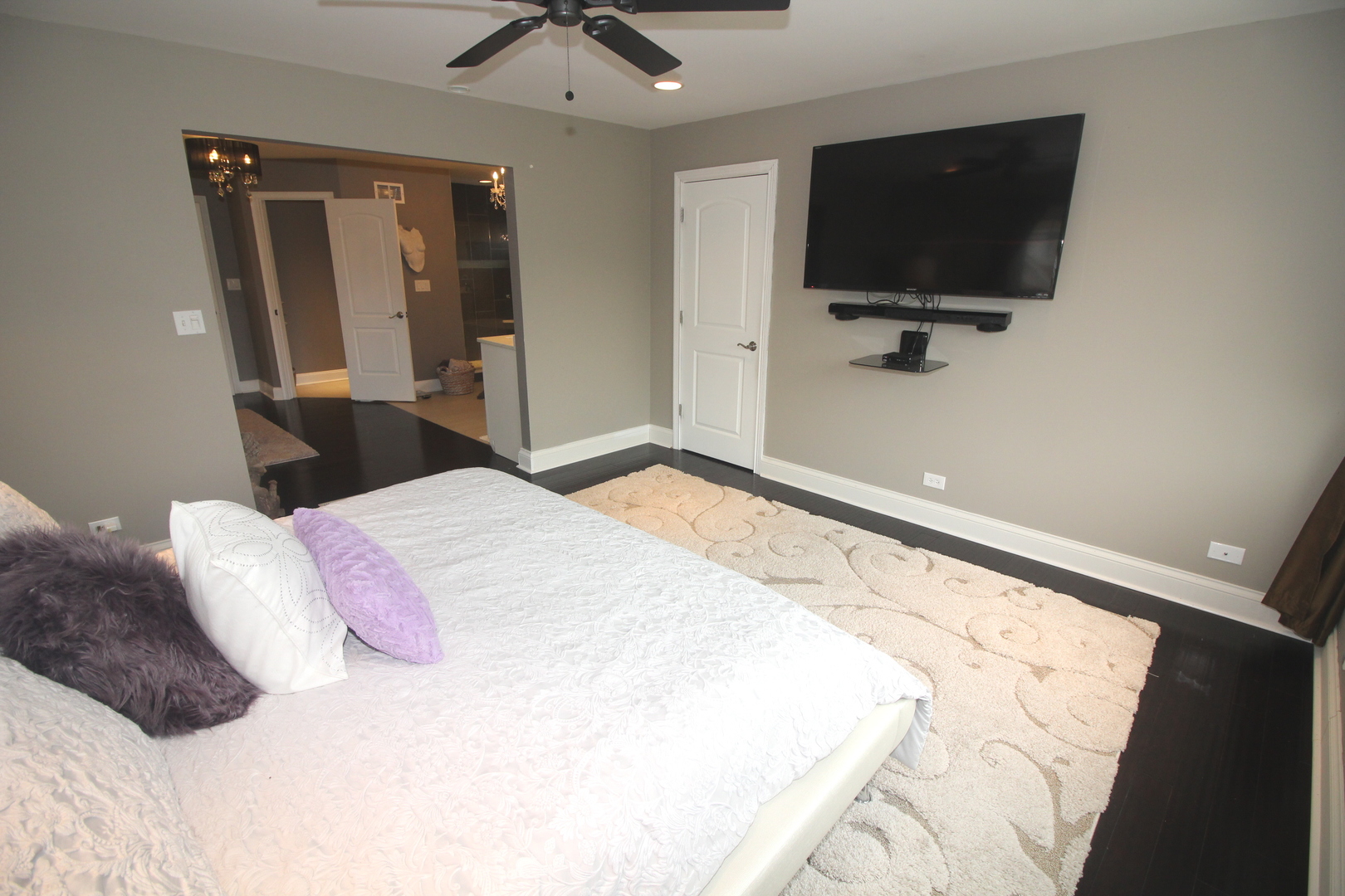 913 Surrey Road Addison, IL 60101 - Photo 19 of 44 a bedroom with a bed and a flat screen tv