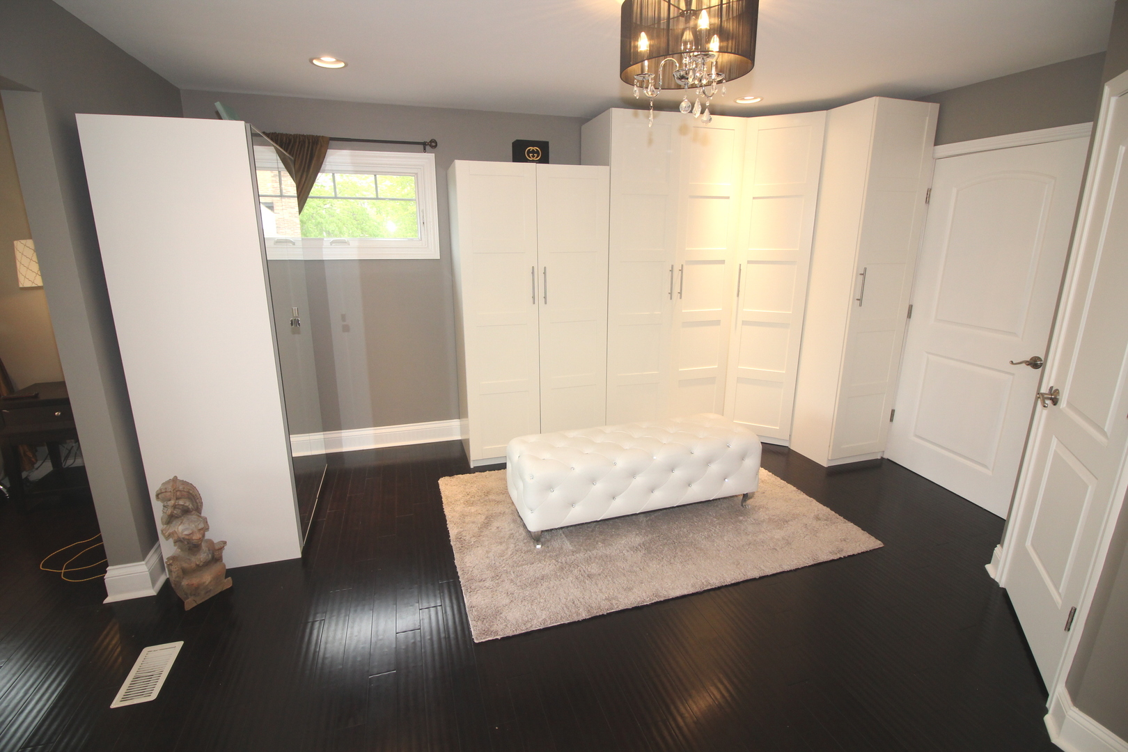 913 Surrey Road Addison, IL 60101 - Photo 23 of 44 a living room with a window and a wooden floor