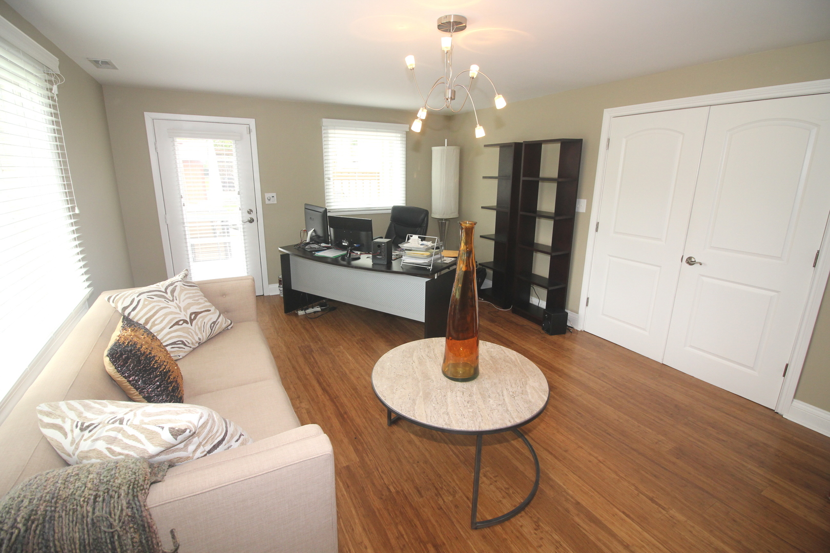 913 Surrey Road Addison, IL 60101 - Photo 30 of 44 a living room with furniture and a wooden floor