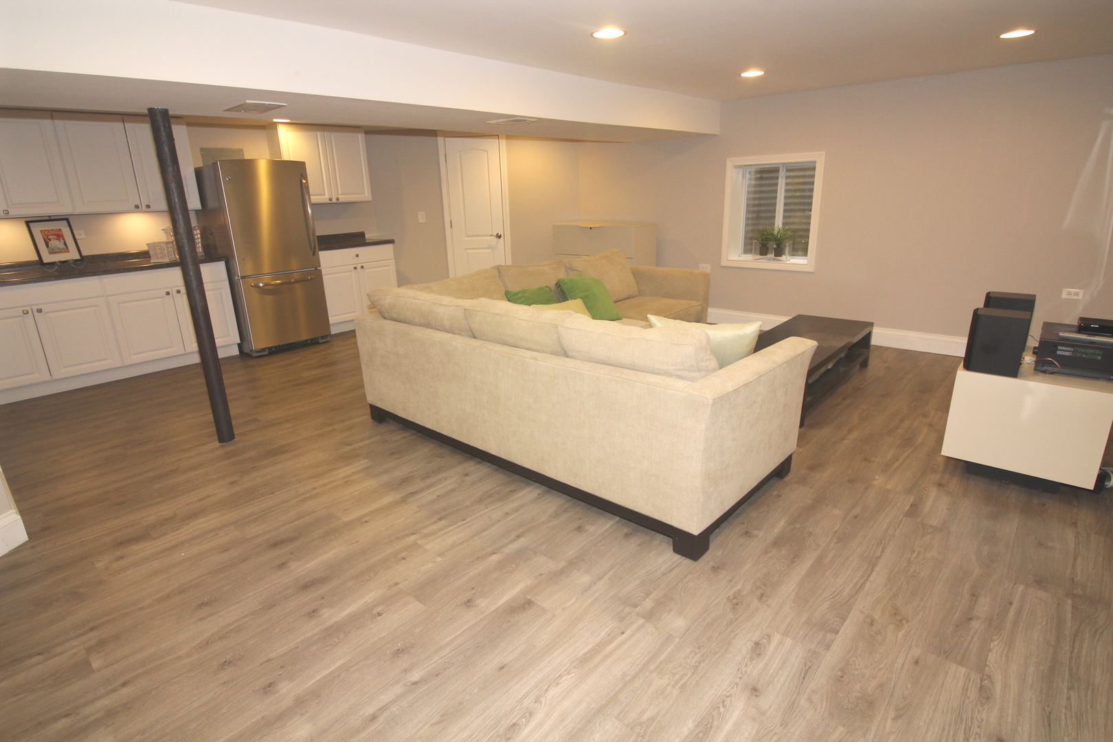 913 Surrey Road Addison, IL 60101 - Photo 33 of 44 a living room with furniture and a wooden floor