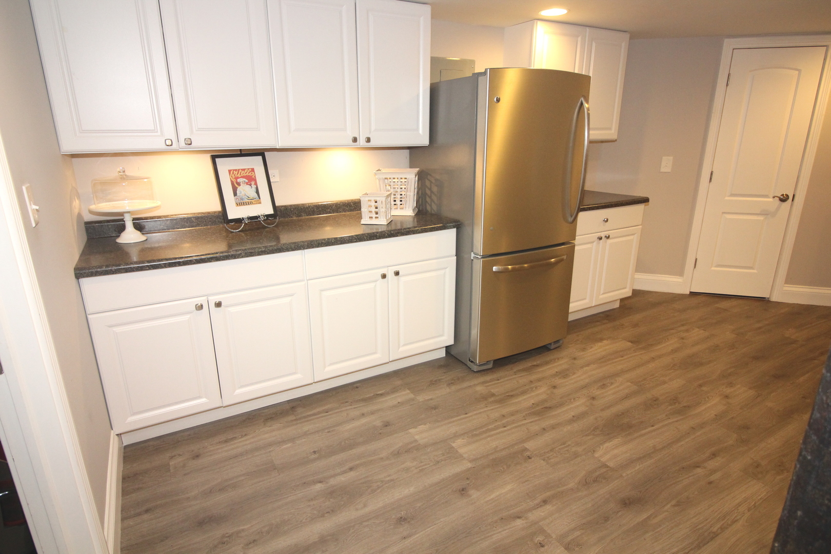 913 Surrey Road Addison, IL 60101 - Photo 34 of 44 a kitchen with stainless steel appliances granite countertop a refrigerator sink and cabinets