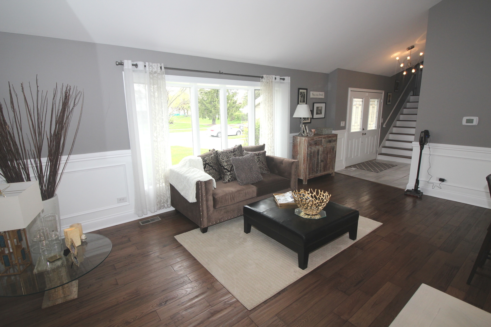 913 Surrey Road Addison, IL 60101 - Photo 5 of 44 a living room with furniture and a large window