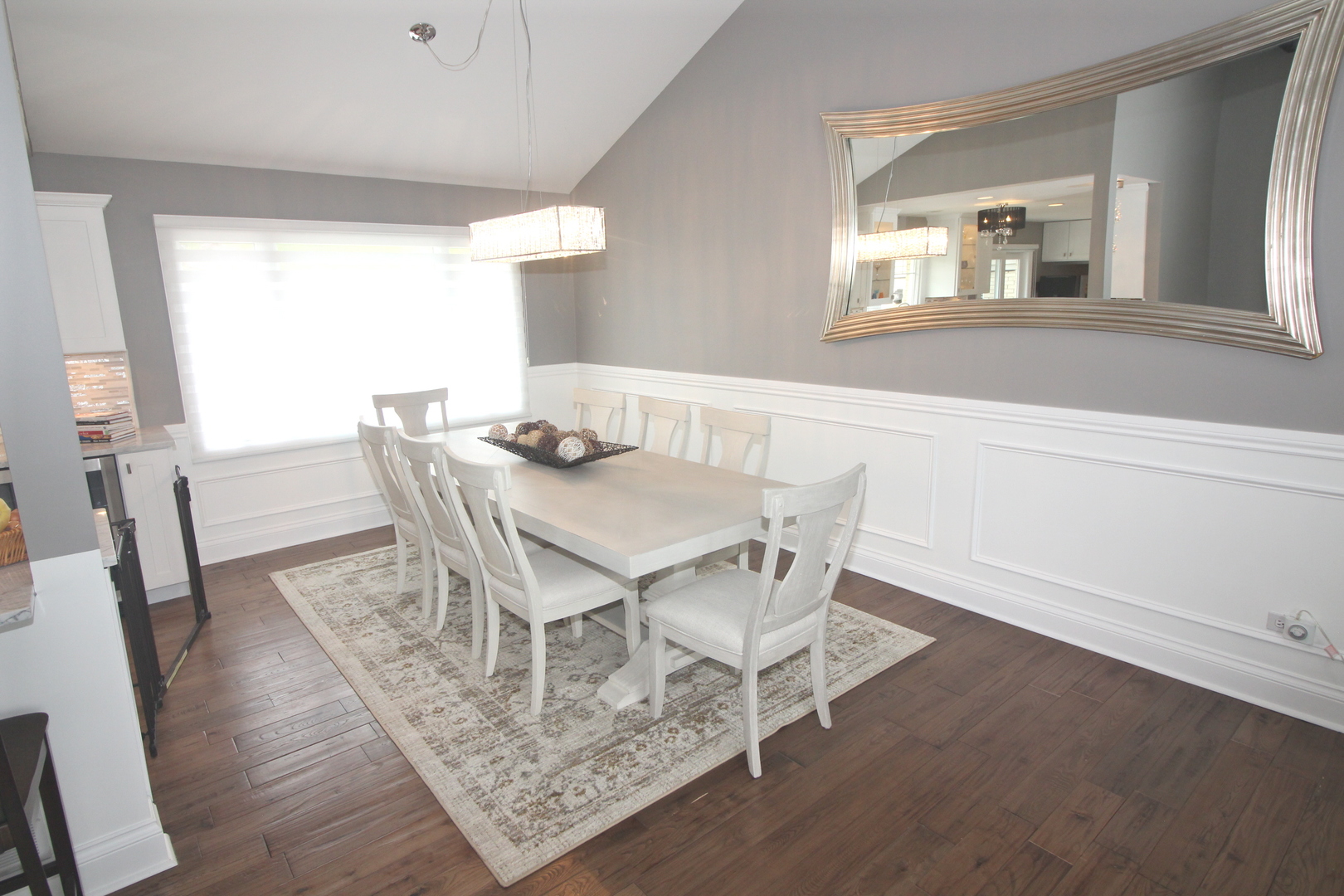 913 Surrey Road Addison, IL 60101 - Photo 7 of 44 a view of a dining room with furniture and wooden floor