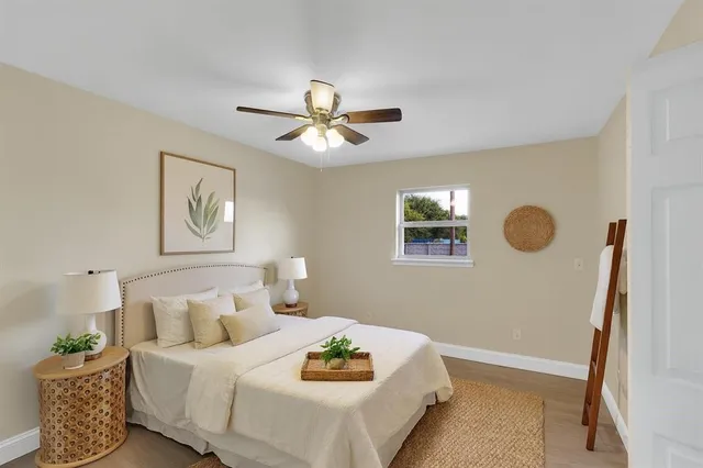 a bedroom with a bed and a window