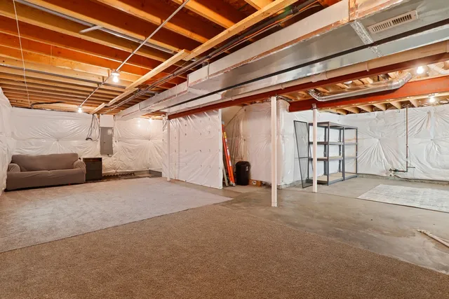 a view of the room with furniture