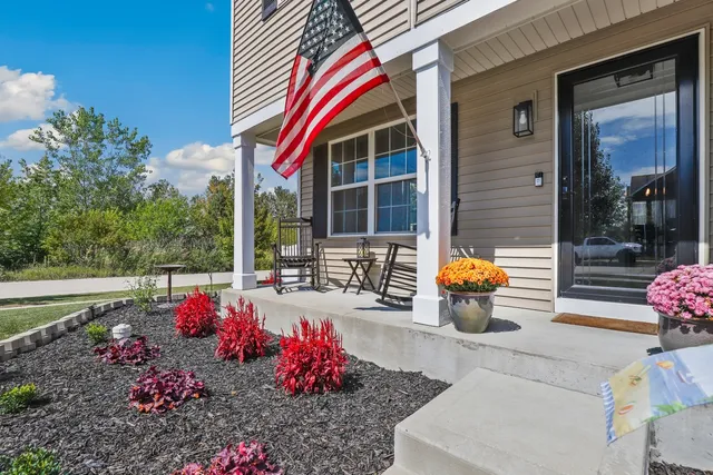 a view of a two chairs in the patio