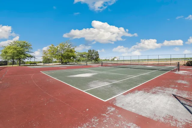 a view of an outdoor space and tennis court