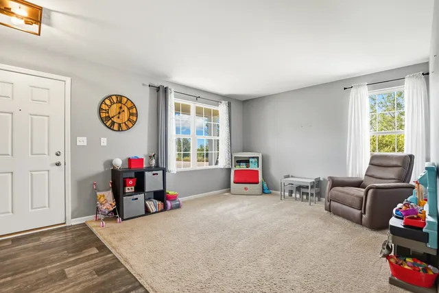 a view of a livingroom with furniture and entryway