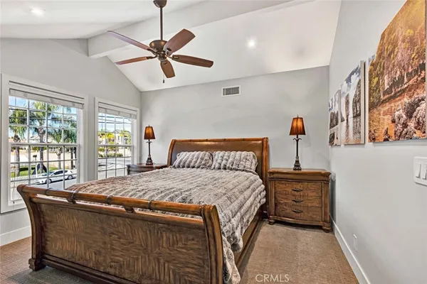 a bedroom with a bed and window