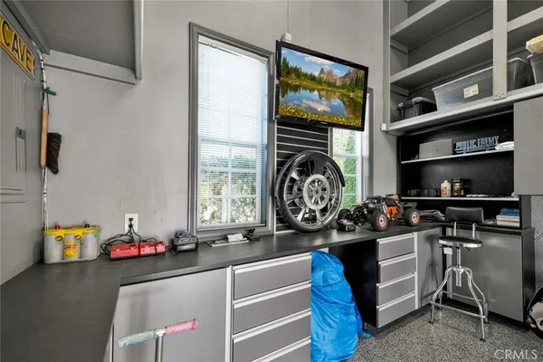 a kitchen with a stove and a window