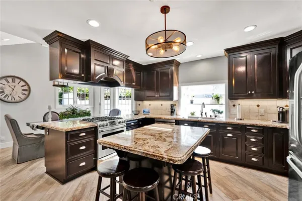a kitchen with a dining table and chairs