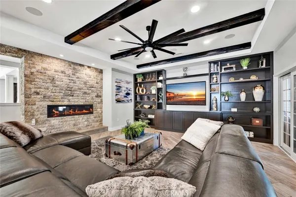 a living room with fireplace furniture and a flat screen tv