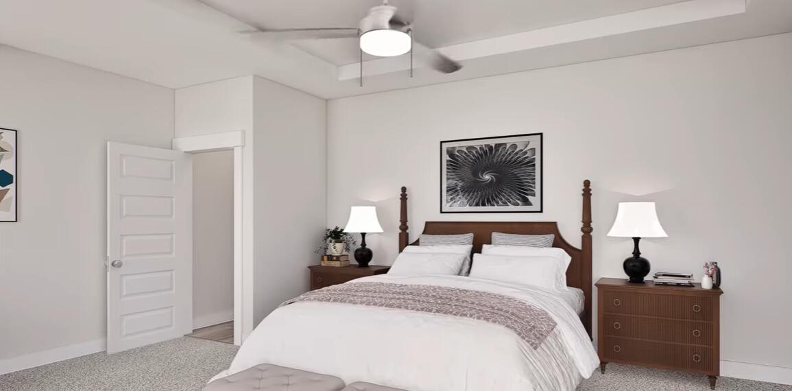542 Staggerbush Street Freeport, FL 32439 - Photo 12 of 26 a bedroom with a bed and a lamp on dresser