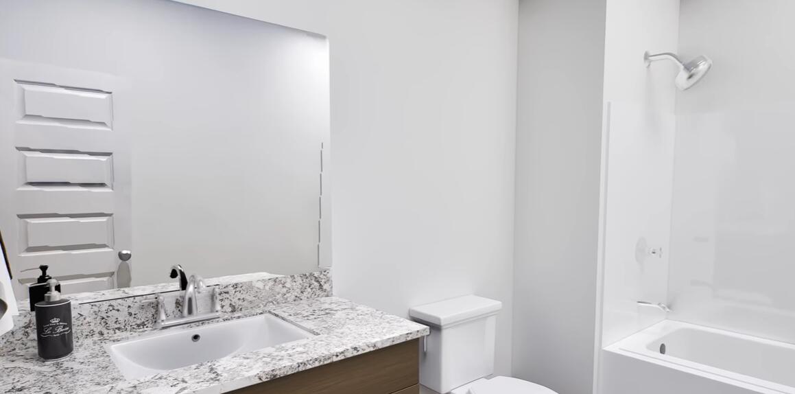 542 Staggerbush Street Freeport, FL 32439 - Photo 18 of 26 a bathroom with a granite countertop sink toilet and shower