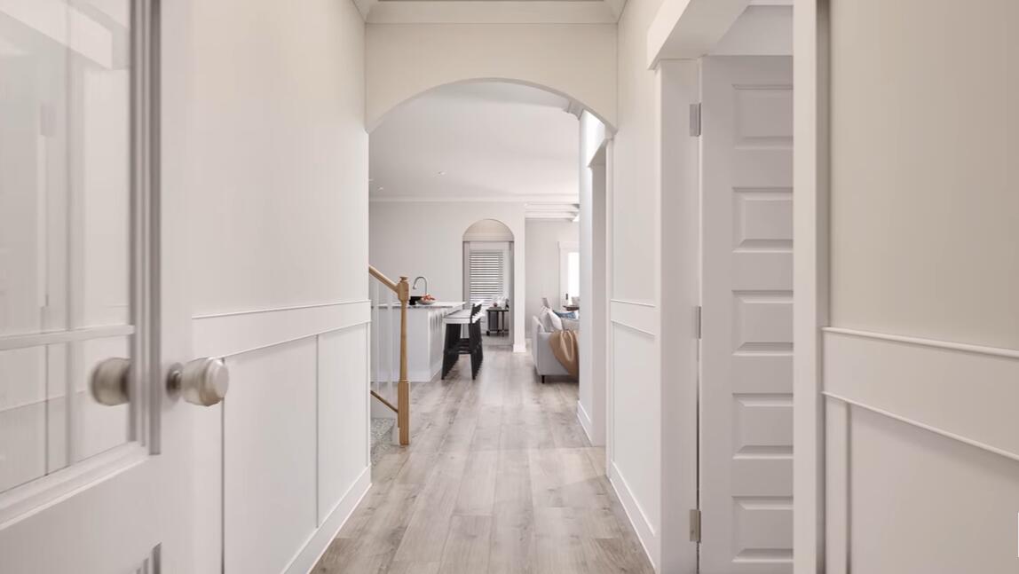 542 Staggerbush Street Freeport, FL 32439 - Photo 4 of 26 a view of a hallway with wooden floor and staircase