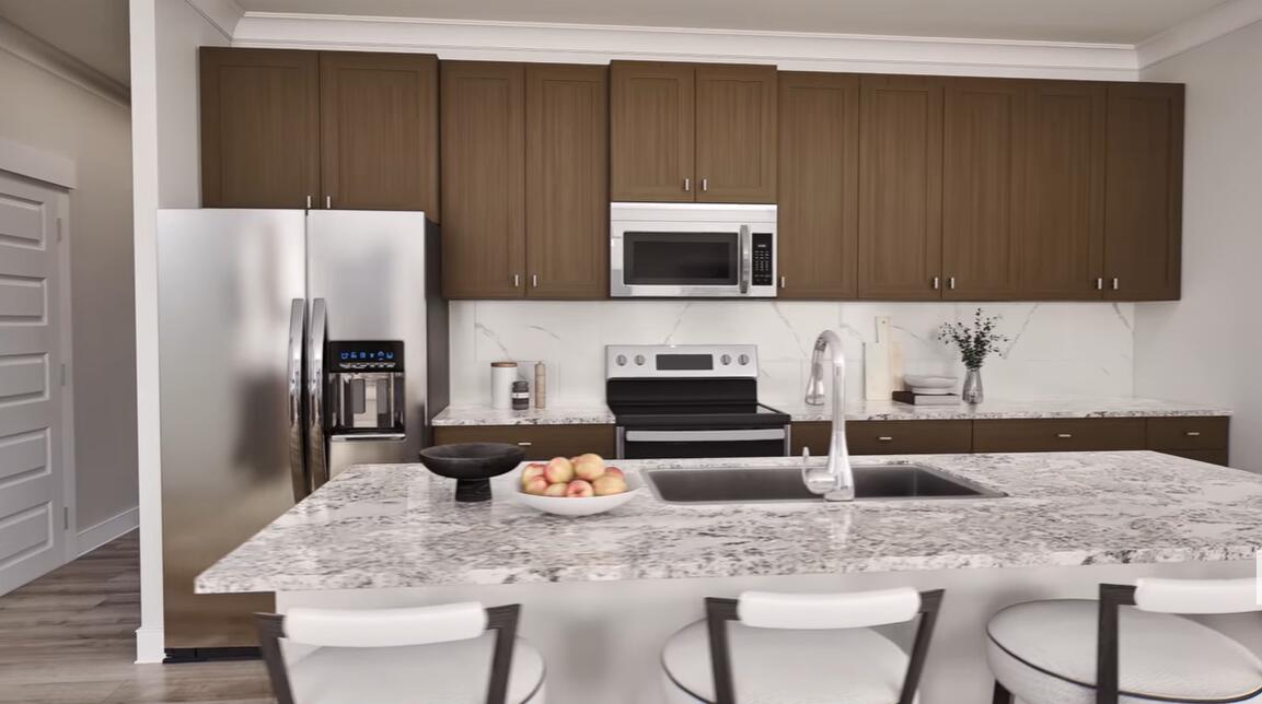 542 Staggerbush Street Freeport, FL 32439 - Photo 6 of 26 a kitchen with a sink a microwave and refrigerator