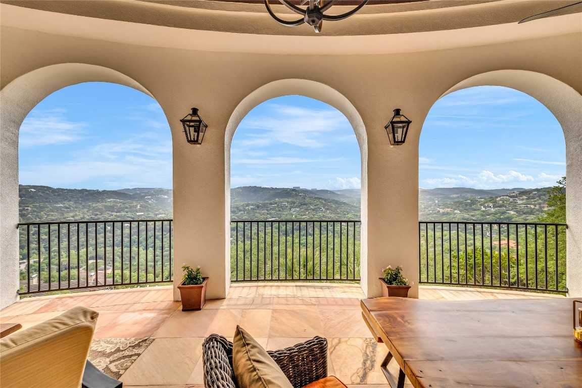 a view of balcony with a floor to ceiling window