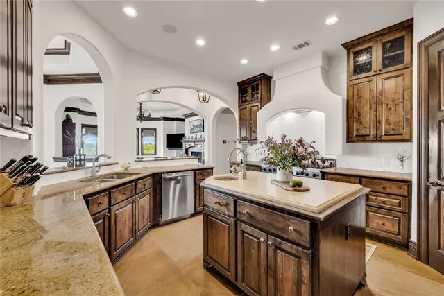 a kitchen with sink stove and cabinets