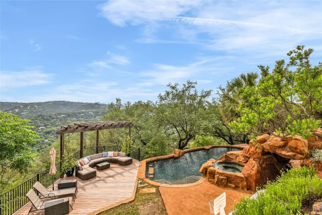 a view of a swimming pool with a patio
