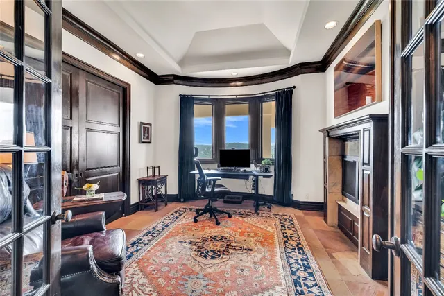 a room with stainless steel appliances kitchen island granite countertop furniture a rug and a view of living room