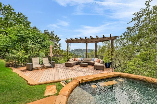 a view of swimming pool with seating space