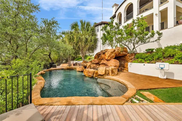 a view of a swimming pool with a patio