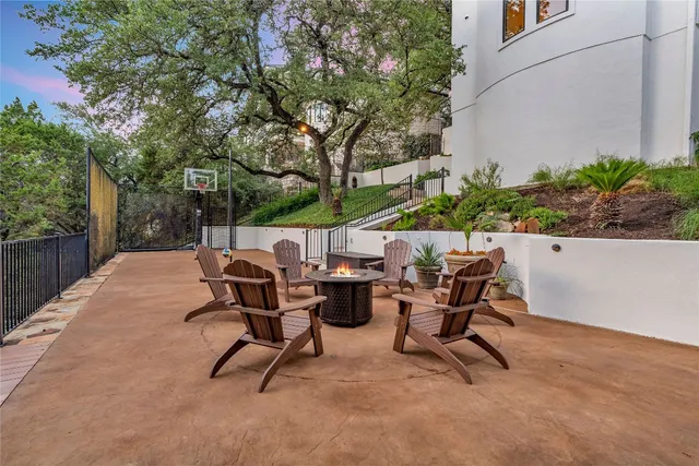 a view of backyard with a table and chairs