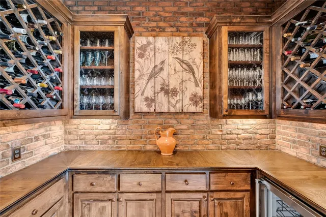 a kitchen with granite countertop a sink and a stove
