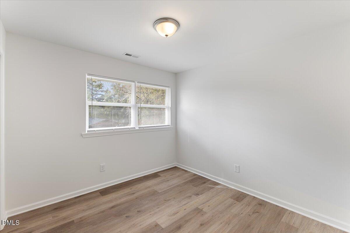 3305 Friar Tuck Road Raleigh, NC 27610 - Photo 11 of 18 an empty room with a window