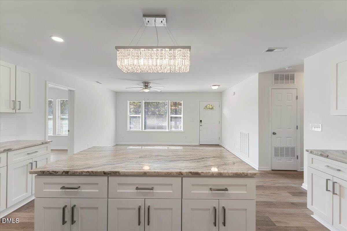 3305 Friar Tuck Road Raleigh, NC 27610 - Photo 3 of 18 a view of kitchen counter top space cabinets and refrigerator