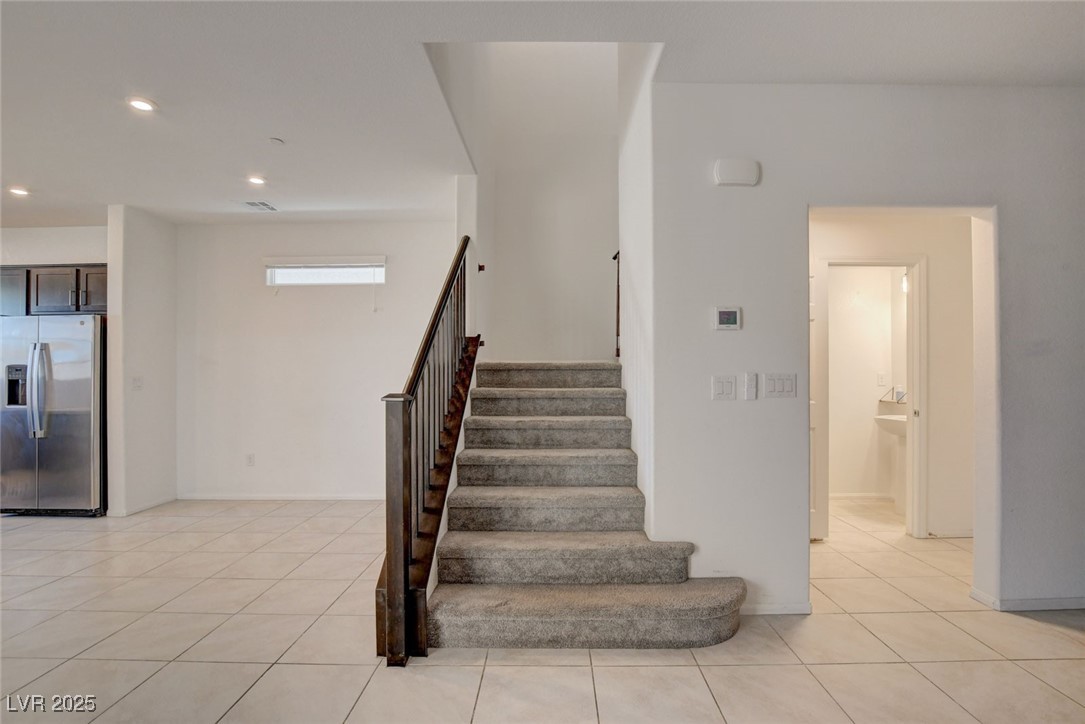 1360 Cerulean Avenue Henderson, NV 89002 - Photo 26 of 62 Stairs with tile patterned flooring and recessed lighting