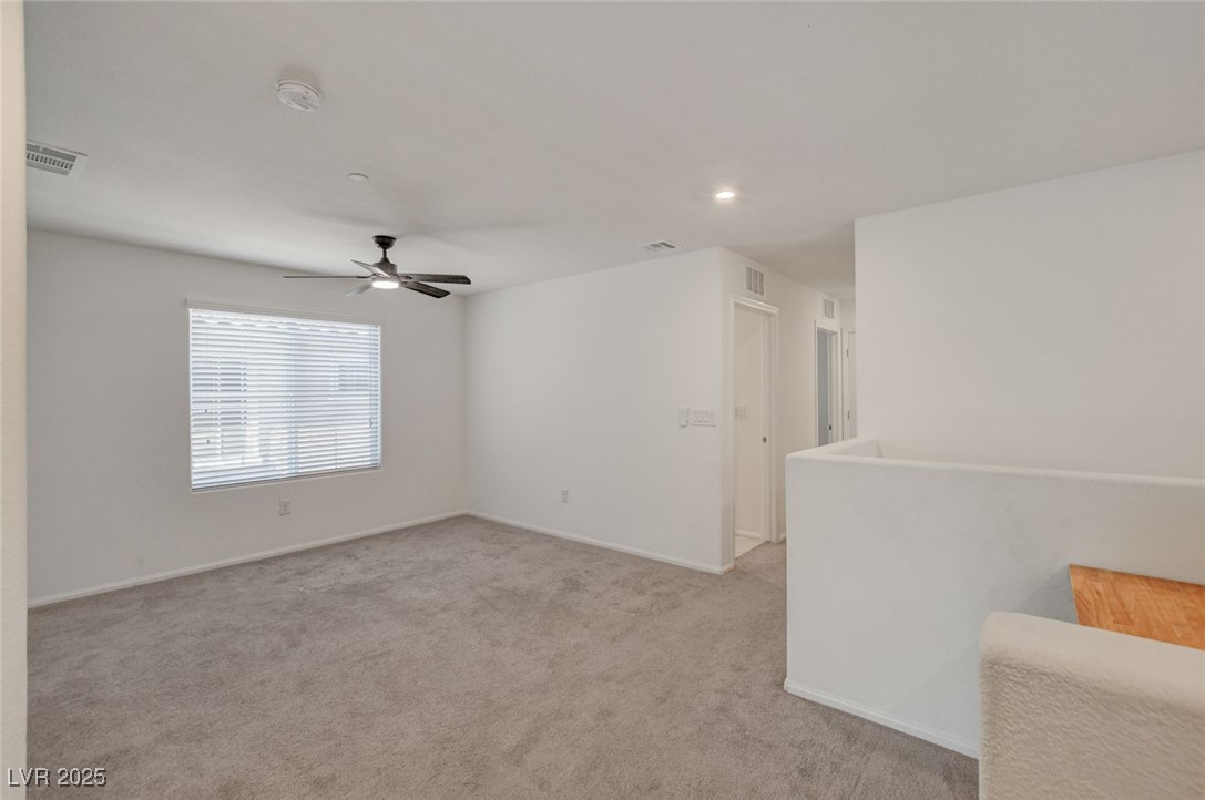 1360 Cerulean Avenue Henderson, NV 89002 - Photo 27 of 62 Carpeted spare room with recessed lighting and ceiling fan