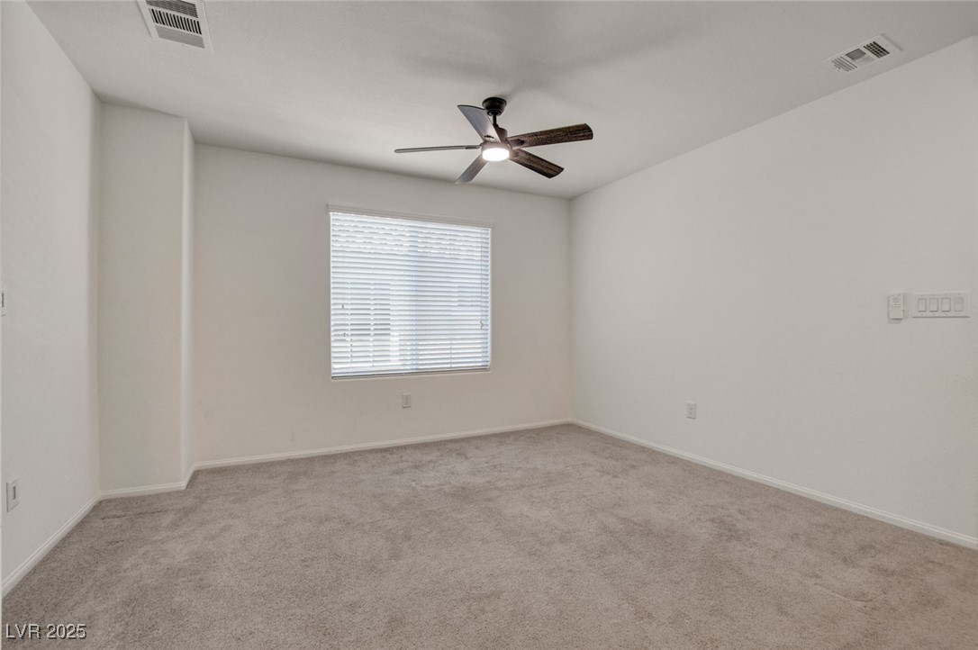 1360 Cerulean Avenue Henderson, NV 89002 - Photo 28 of 62 Spare room featuring light carpet and ceiling fan
