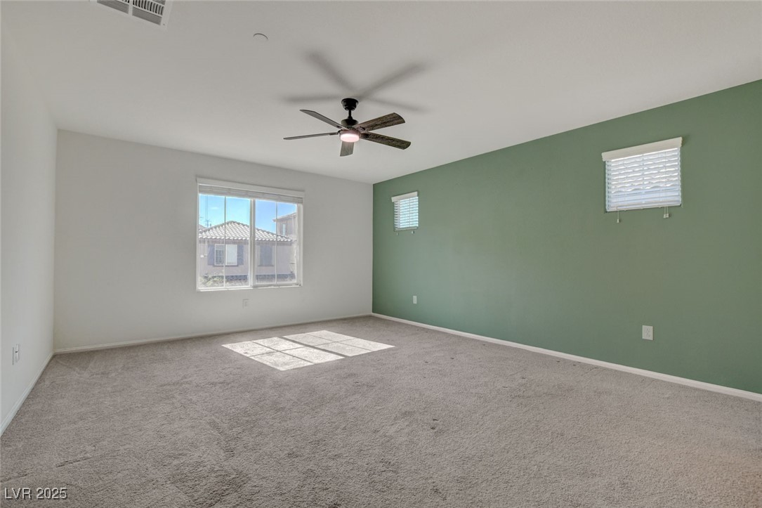 1360 Cerulean Avenue Henderson, NV 89002 - Photo 33 of 62 Carpeted empty room featuring plenty of natural light and ceiling fan
