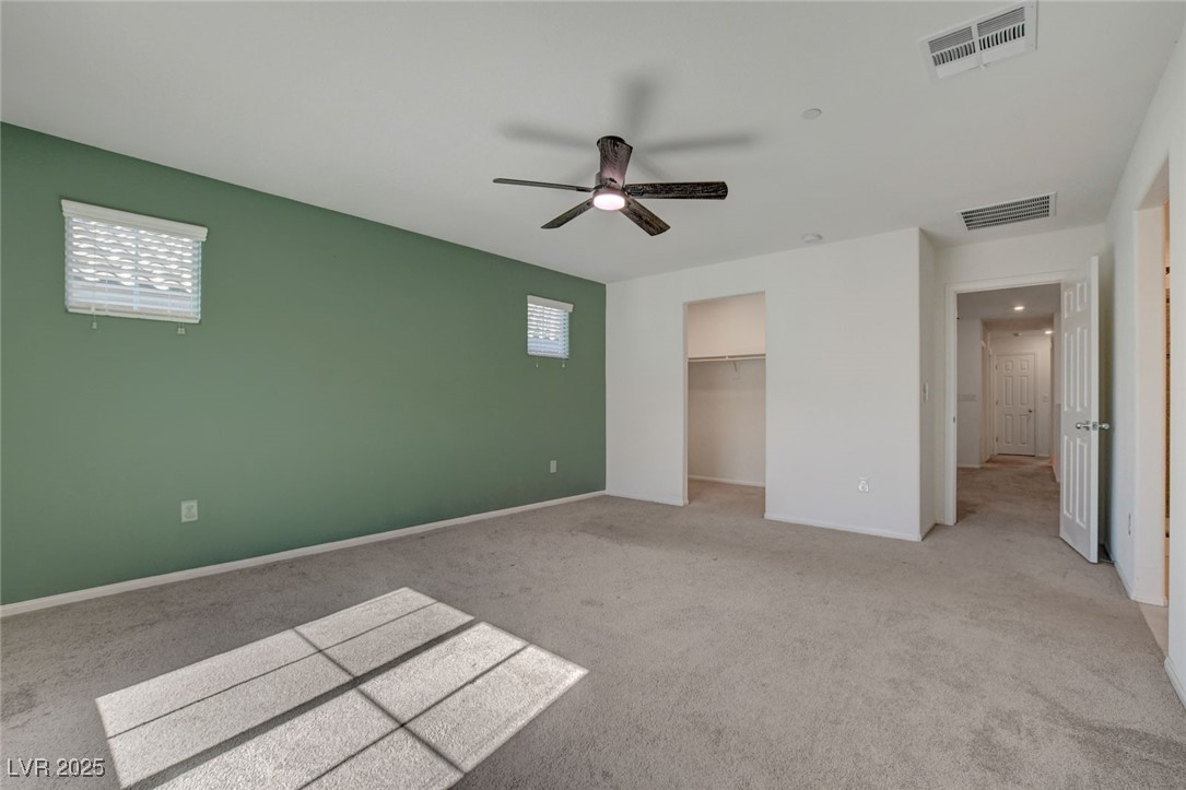 1360 Cerulean Avenue Henderson, NV 89002 - Photo 34 of 62 Unfurnished bedroom featuring light carpet, a walk in closet, and ceiling fan