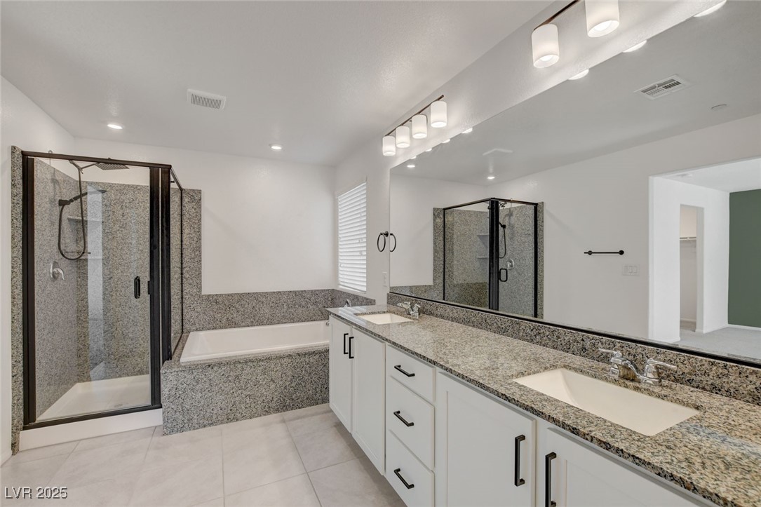 1360 Cerulean Avenue Henderson, NV 89002 - Photo 37 of 62 Full bath featuring a bath, double vanity, a shower stall, light tile patterned flooring, and recessed lighting