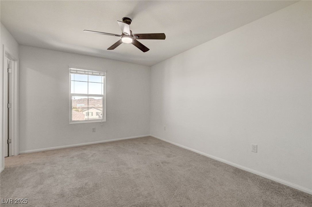 1360 Cerulean Avenue Henderson, NV 89002 - Photo 46 of 62 Empty room featuring light colored carpet and a ceiling fan