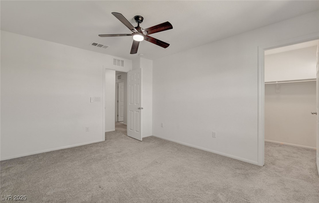 1360 Cerulean Avenue Henderson, NV 89002 - Photo 47 of 62 Unfurnished bedroom with a spacious closet, light carpet, and ceiling fan