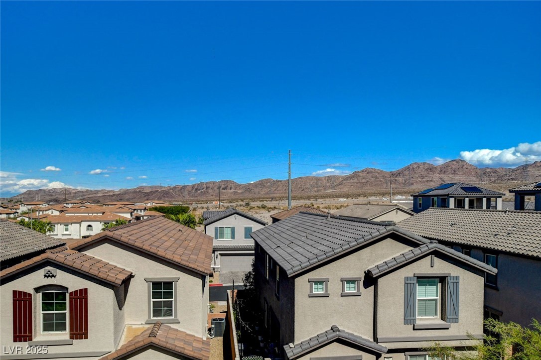 1360 Cerulean Avenue Henderson, NV 89002 - Photo 52 of 62 View of front of property featuring a residential view, a mountain view, stucco siding, and a tile roof