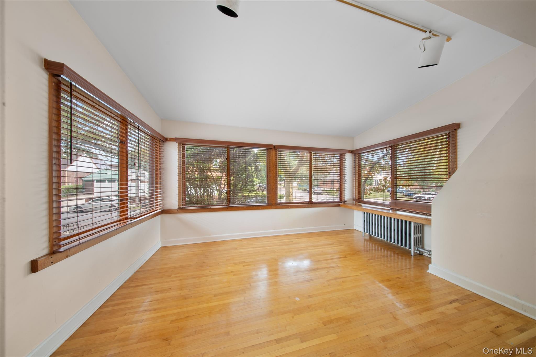 47-69 195th Street Queens, NY 11358 - Photo 2 of 12 a view of an empty room with a window