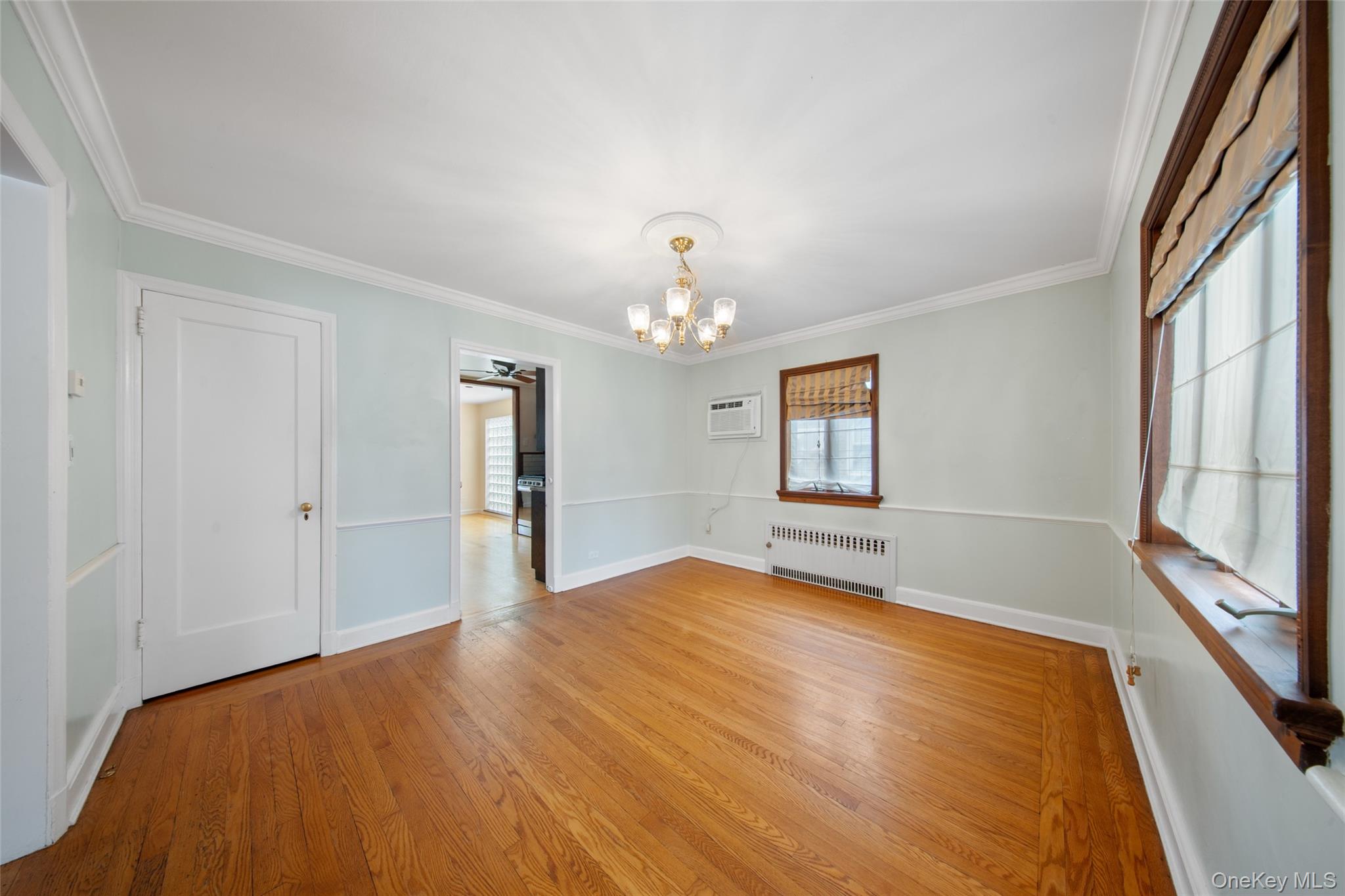 47-69 195th Street Queens, NY 11358 - Photo 3 of 12 a bedroom with a bed and a window