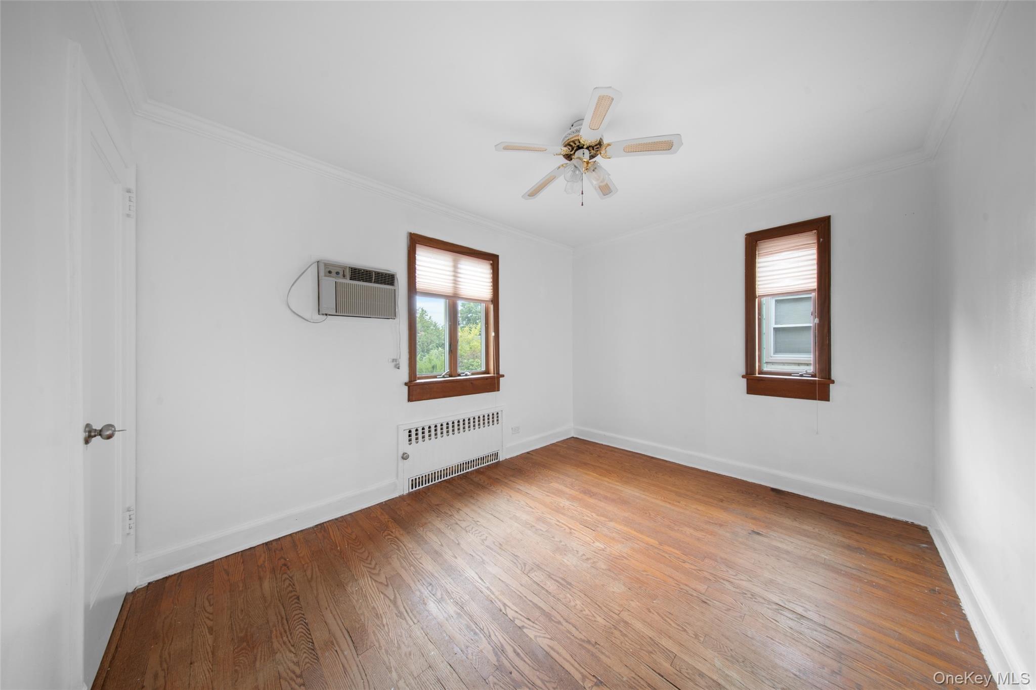 47-69 195th Street Queens, NY 11358 - Photo 5 of 12 a view of an empty room and window