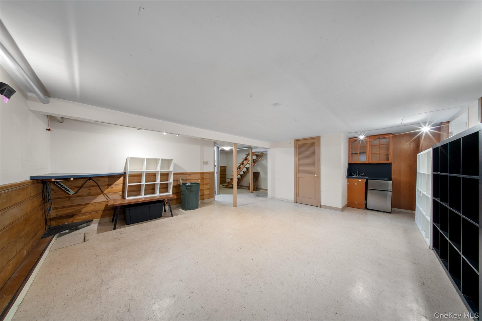 47-69 195th Street Queens, NY 11358 - Photo 7 of 12 a living room with furniture and kitchen view