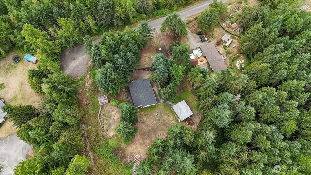 an aerial view of a house with outdoor space and street view