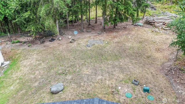 a view of a yard with trees
