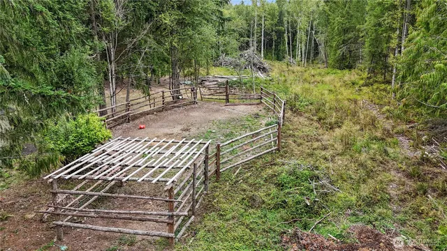 a view of a backyard with sitting area