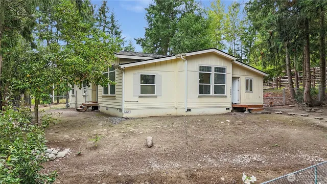a house with trees in the background