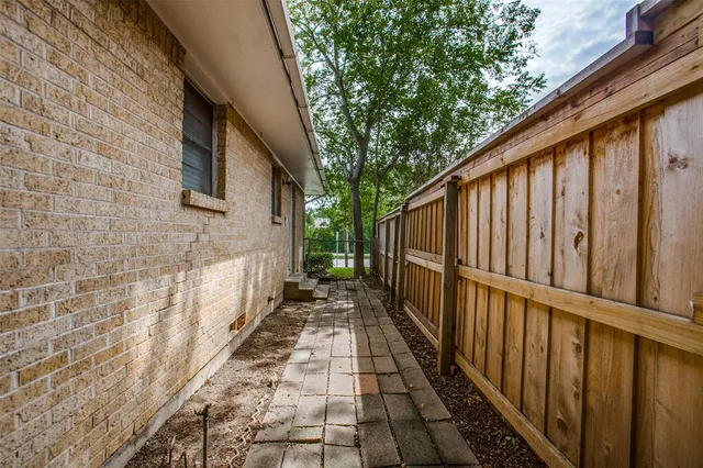 a view of a pathway with a backyard