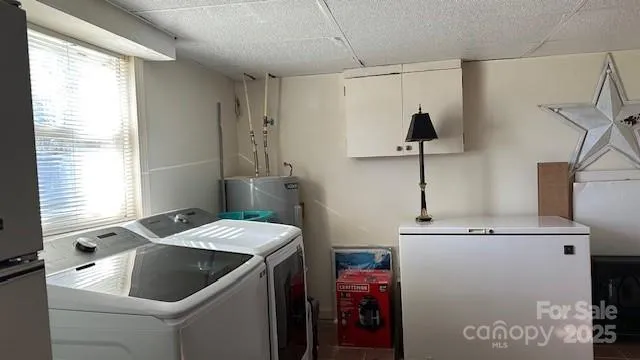 a kitchen with a sink cabinets and appliances