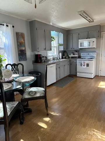 a kitchen with a sink cabinets and window